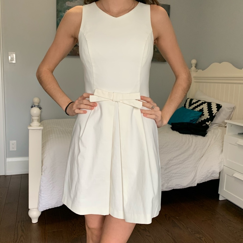 Fitted white/cream dress.
